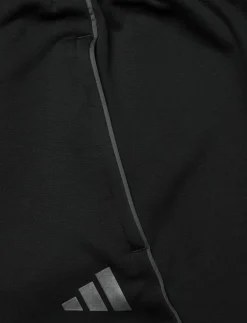 Kvinnor adidas Performance Byxor|Mjukisbyxor|TIRO25C WINPTW - Casual byxor